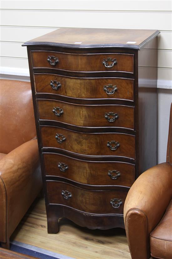 A walnut serpentine fronted chest of six drawers W.60cm